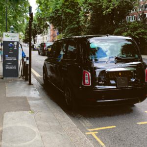 Electric Black Taxi pulling in for a charge