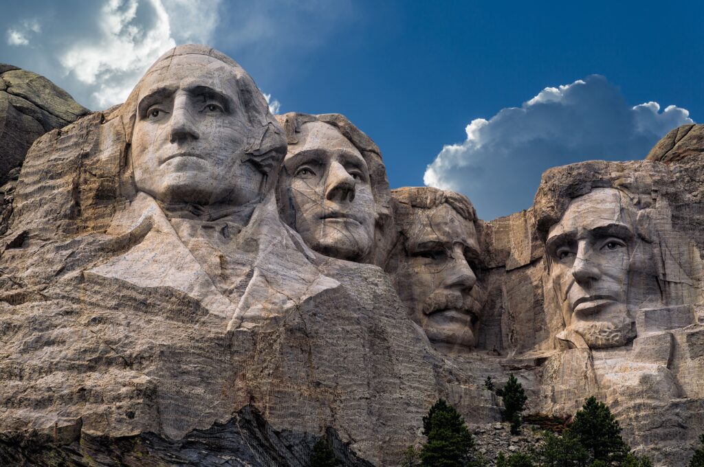 Sculpted memorials at Mount Rushmore against blue cloudy sky